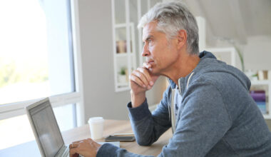 Senior thinking about his finances, investments, retirement plans and other money considerations.