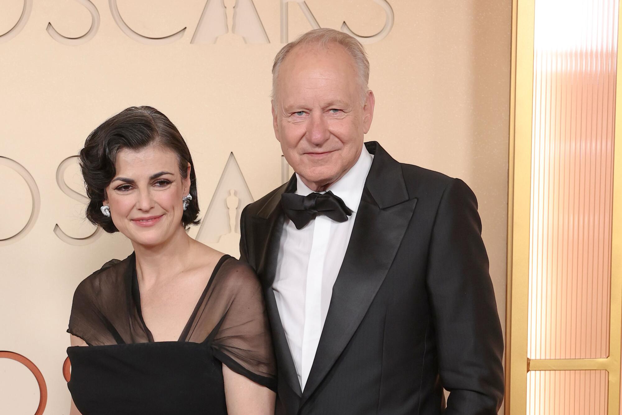 Megan Everett-Skarsgård and Stellan Skarsgård arrive on the red carpet at the 98th Annual Academy Awards.