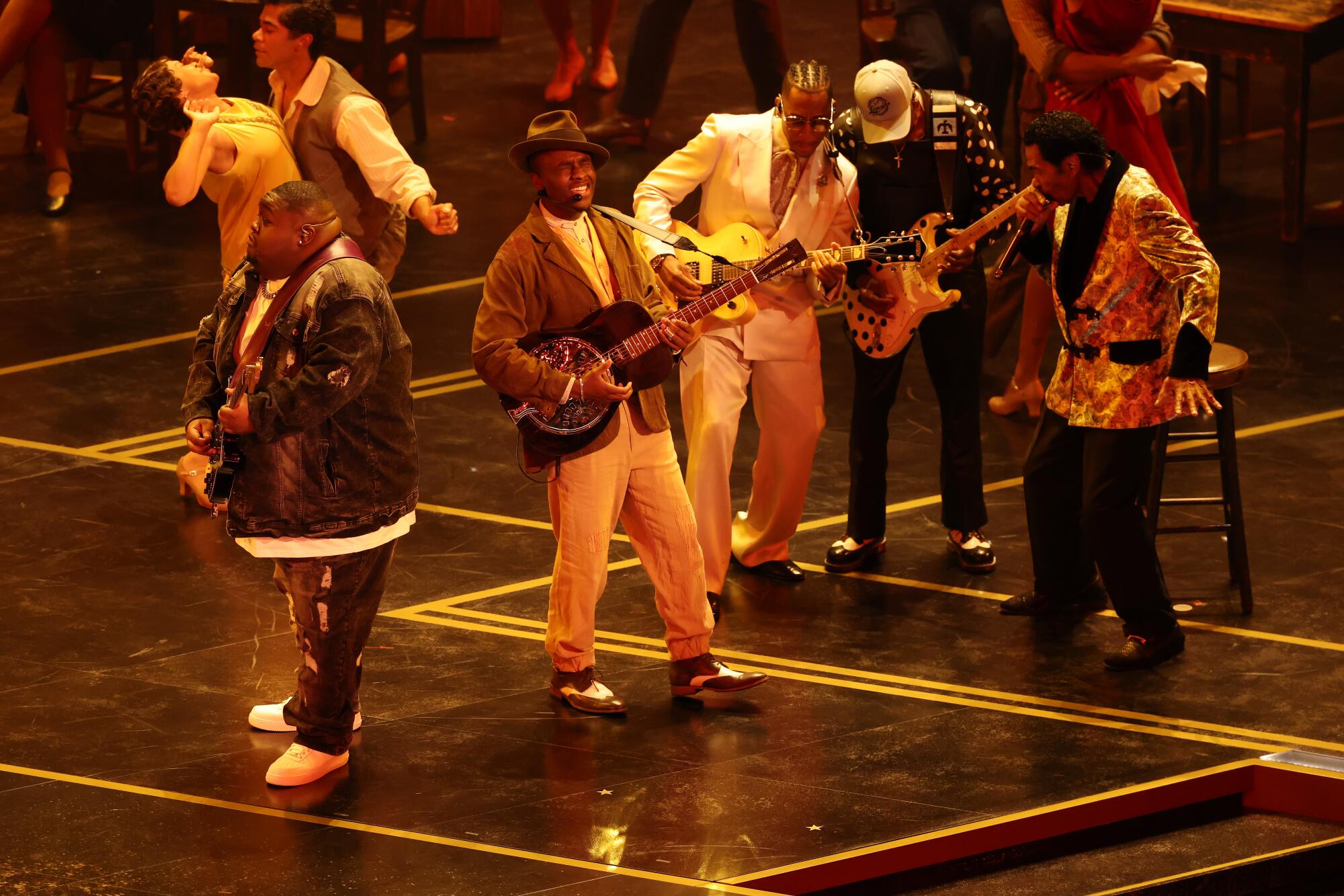 Blues musicians on stage playing at the Oscars