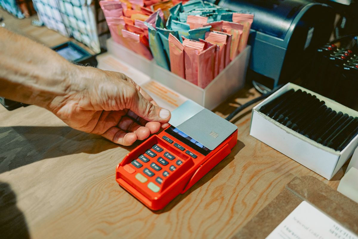Person paying with a card