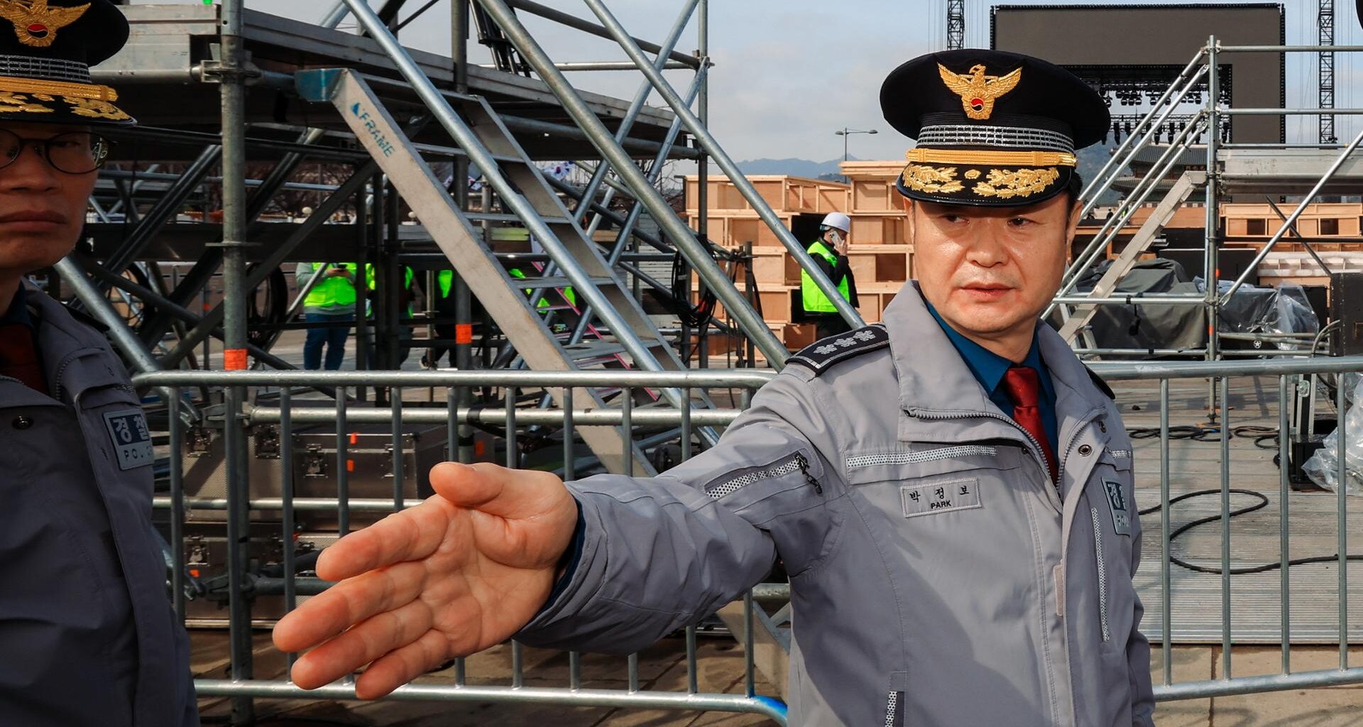 Park Jeong-bo, chief of the Seoul Metropolitan Police Agency, checks the stage for BTS