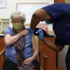Martha Wilson, of Chapel Hill, gets a COVID-19 vaccine in Pittsboro, N.C at Piedmont Health Senior Care, a federally qualified health center where underserved populations can receive the vaccine.