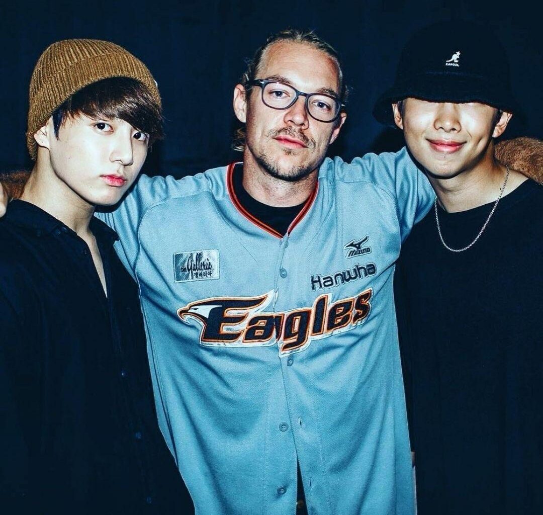 American producer Diplo, center, with BTS members Jung Kook, left, and RM / Captured from Diplo
