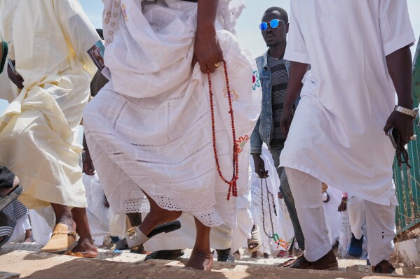 Muslims attend the last Friday prayers of the holy month of Ramadan in Dakar, Senegal, Friday, March 13, 2026. (AP Photo/Misper Apawu)
