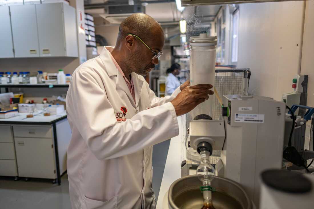 Professor Kelly Chibale inspects a piece of quipment in his synthetic chemistry laboratory at the University of Cape Town. Chibale and his colleagues are working to discover new drugs for a range of diseases.