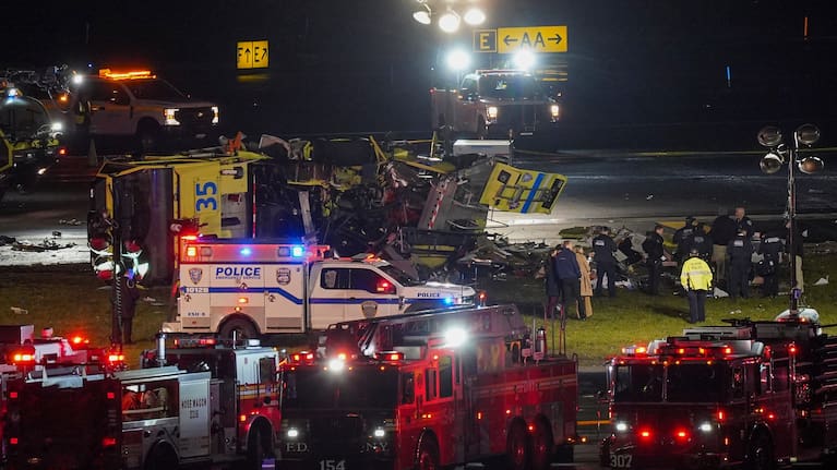 An Air Canada Jet sits on the runway at LaGuardia Airport, Monday, March 23, 2026, after colliding with a Port Authority aircraft rescue and firefighting vehicle in New York. 
