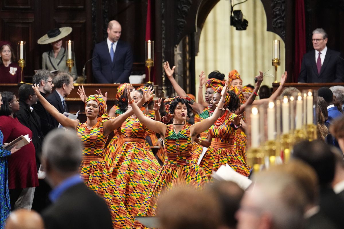The royal couple watch a performance of the African Choir of Norfolk