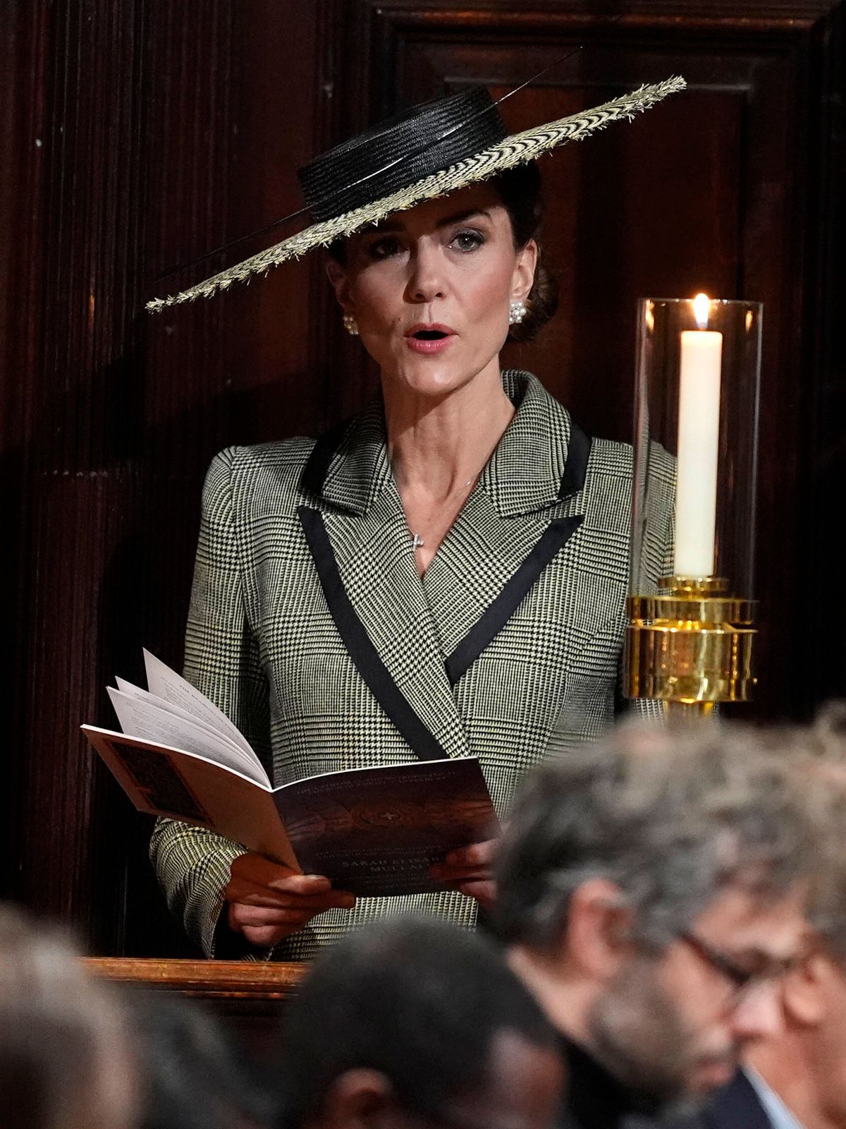 Kate sings along with a hymn