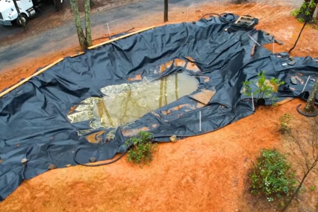 A natural pool with an excavation, waterfall, biological filter, and giant rocks shows how the island has become a bathing area.