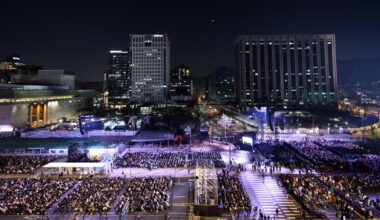 BTS fans are seated at the concert venue at Gwanghwamun Square in Seoul, March 21, before the comeback concert. Joint Press Corps