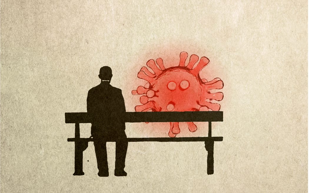 Man sitting on a bench next to Covid particle, illustration. (Photo by FANATIC STUDIO / SCIENCE PHOTO L / FST / Science Photo Library via AFP)