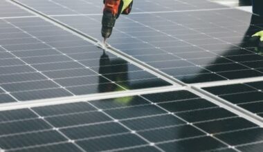 image of a person installing a solar panel