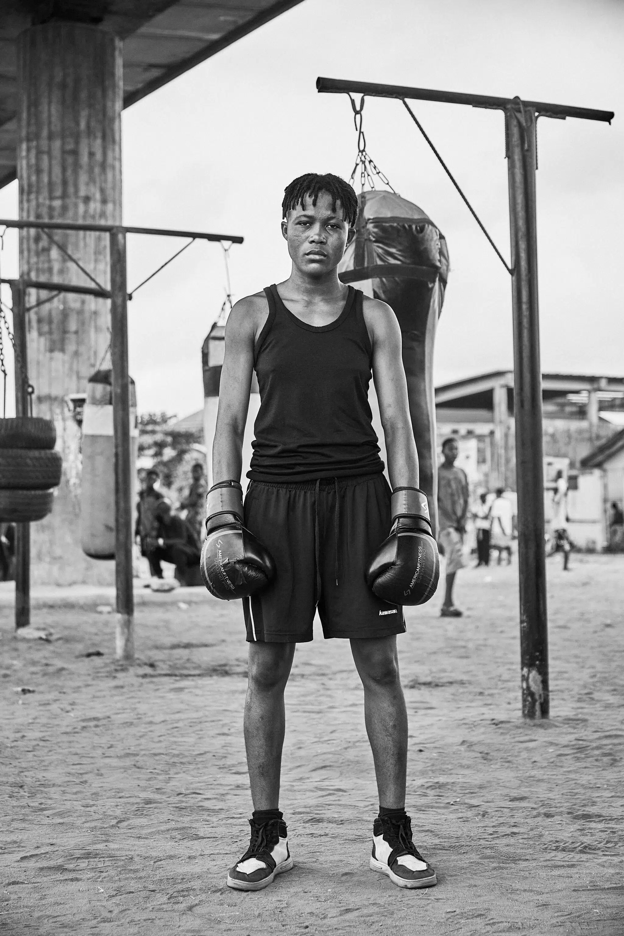 This series documents a makeshift gym underneath an underpass in Lagos, Nigeria, where amateur boxers train.