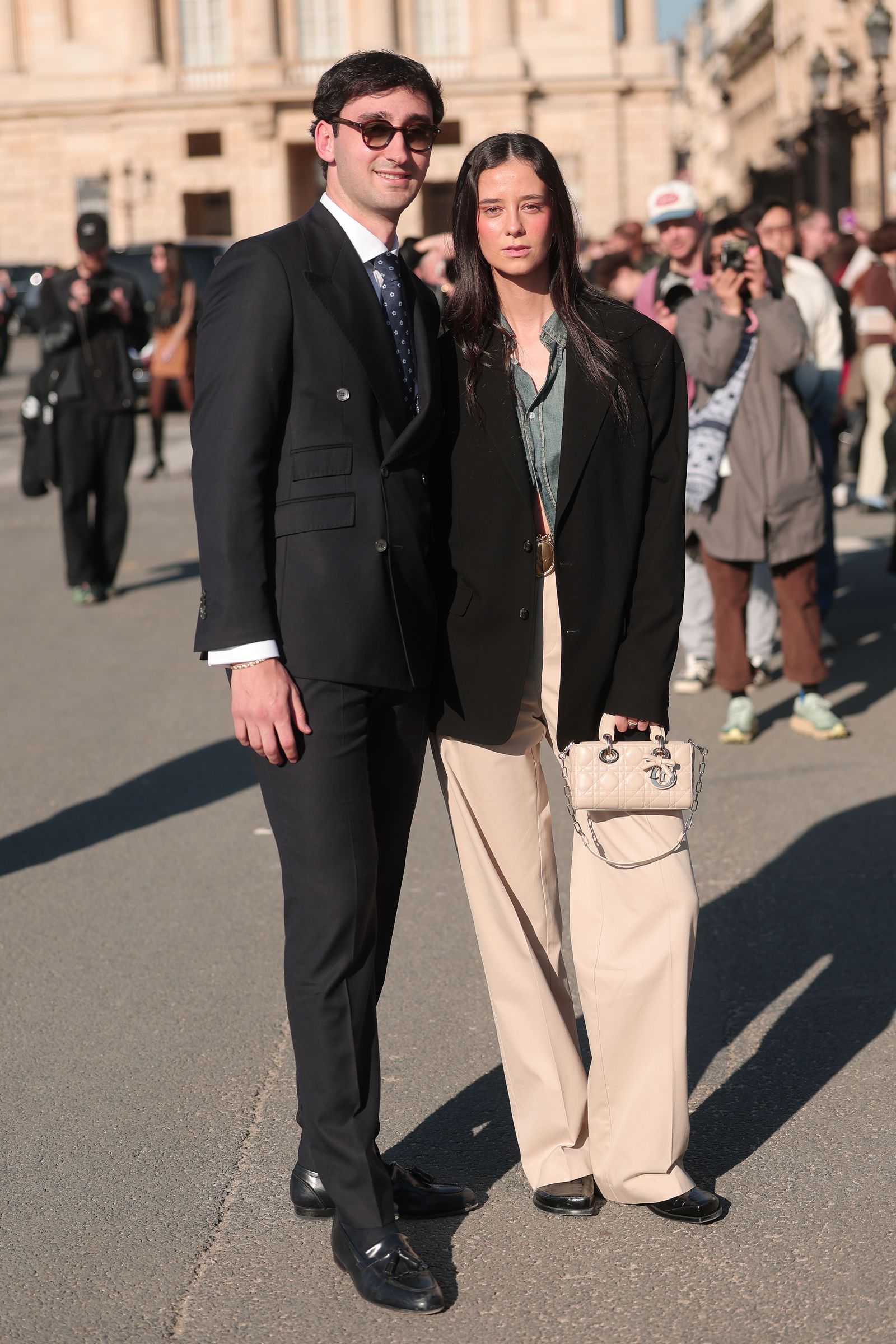 Image may contain Damasus I Blazer Clothing Coat Jacket Formal Wear Suit Adult Person Accessories Bag and Handbag