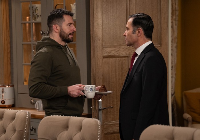 Ross and Graham talk in Home Farm in a scene from Emmerdale