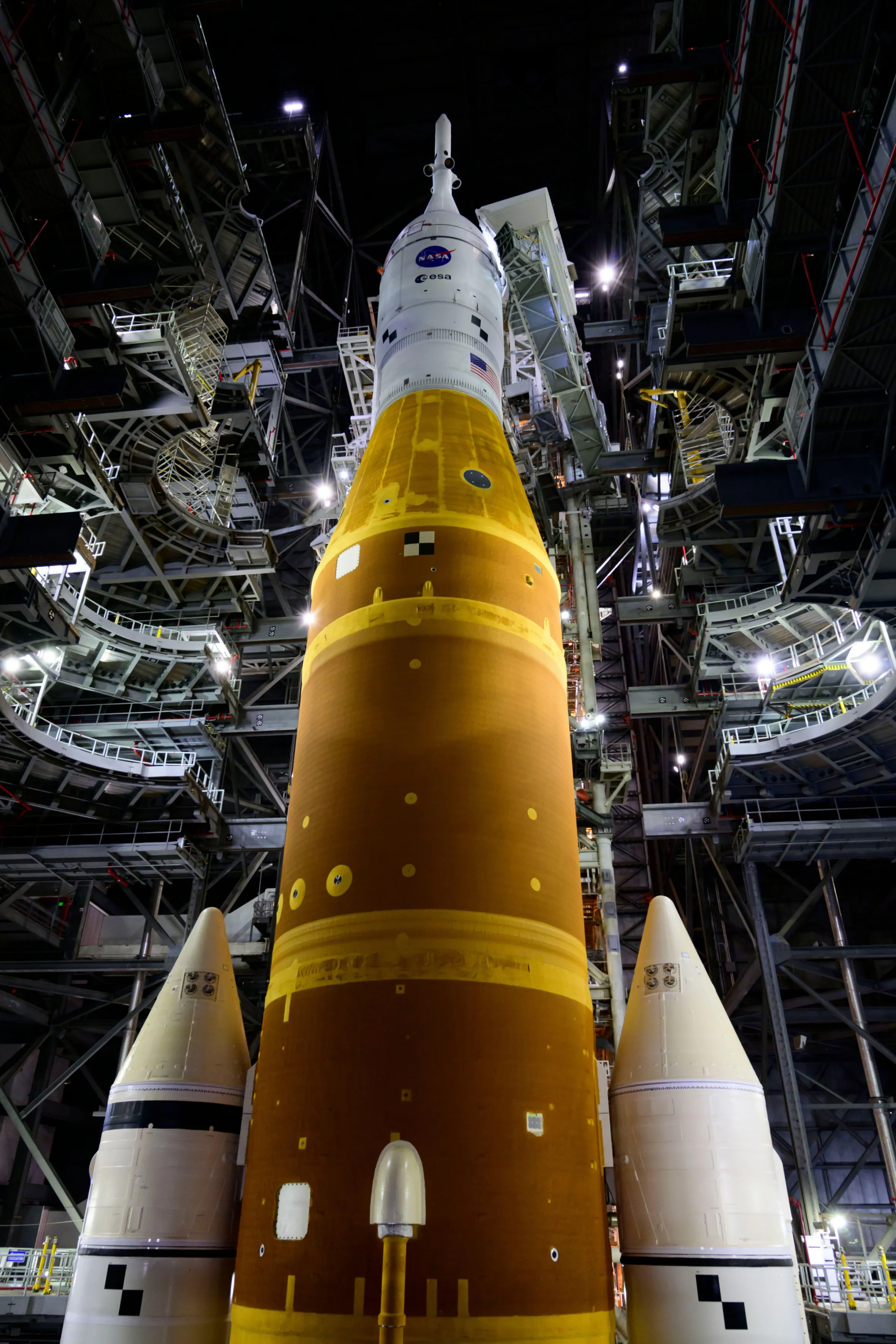 NASA's Space Launch System (SLS) rocket with the Orion capsule atop, seen inside the Vehicle Assembly Building (VAB) at Kennedy Space Center.