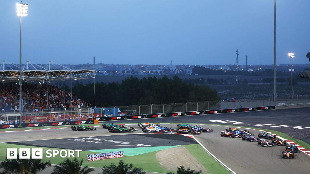 F1 cars race through first corner of Sakhir circuit in Bahrain