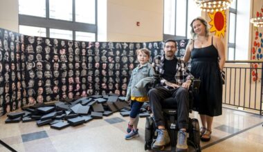 Eric Brunner, 39, of South Philadelphia, poses for a portrait with his wife Allie Brunner, 36, and their son Logan, 7, with Eric’s 3D printed art piece at the Free Library of Philadelphia Parkway Central Library in Philadelphia, Pa., on Wed., March. 11, 2026.