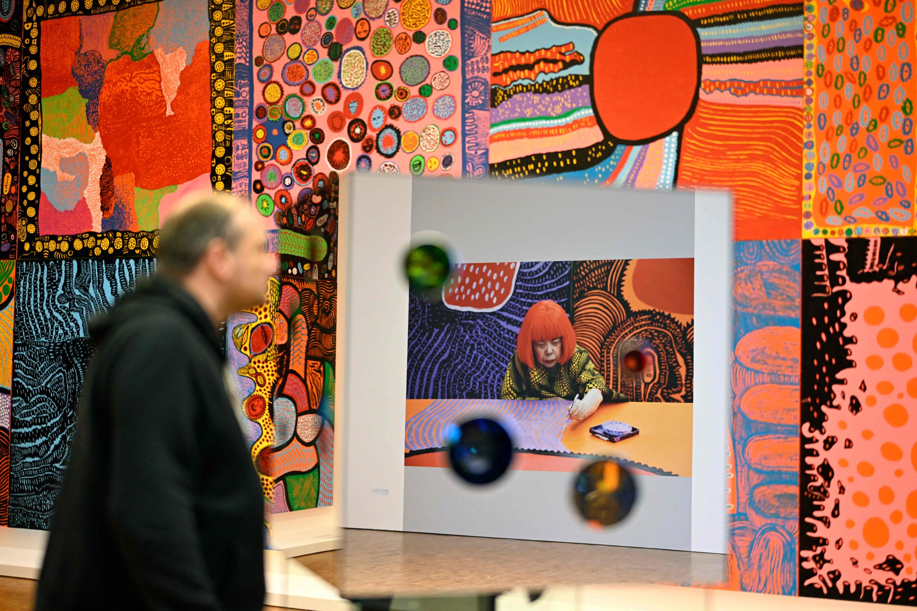 A visitor looks to the installation