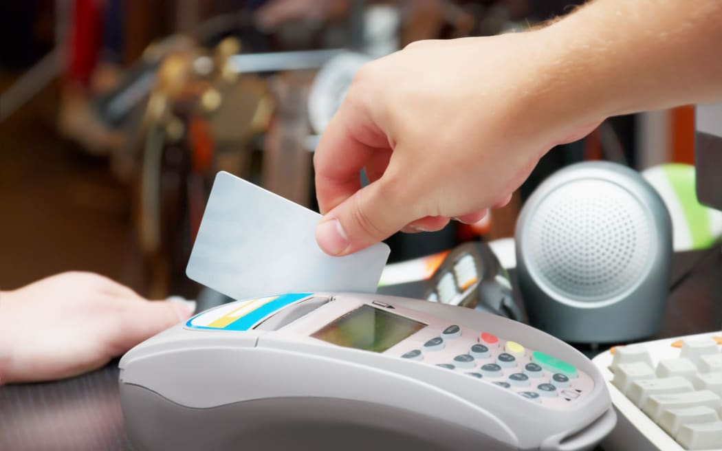 seller hold in his hand a credit card, eftpos