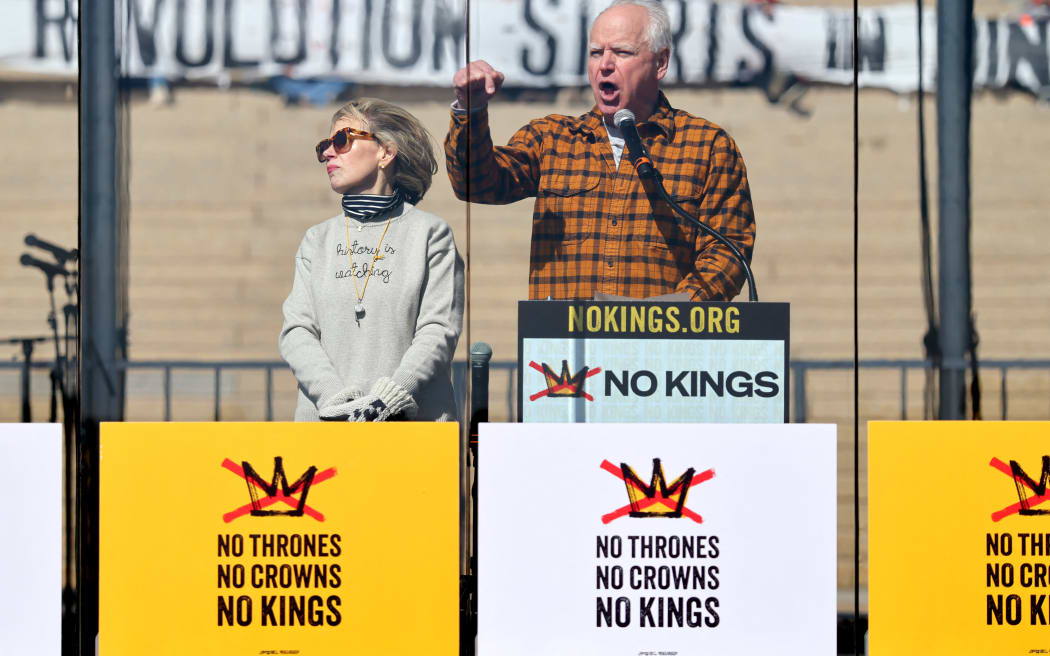 ST PAUL, MINNESOTA - MARCH 28: Minnesota Governor Tim Walz speaks onstage as Hundreds of Thousands Protest as part of the No Kings Rallies on March 28, 2026 in St. Paul, Minnesota.   Adam Bettcher/Getty Images for No Kings/AFP (Photo by Adam Bettcher / GETTY IMAGES NORTH AMERICA / Getty Images via AFP)