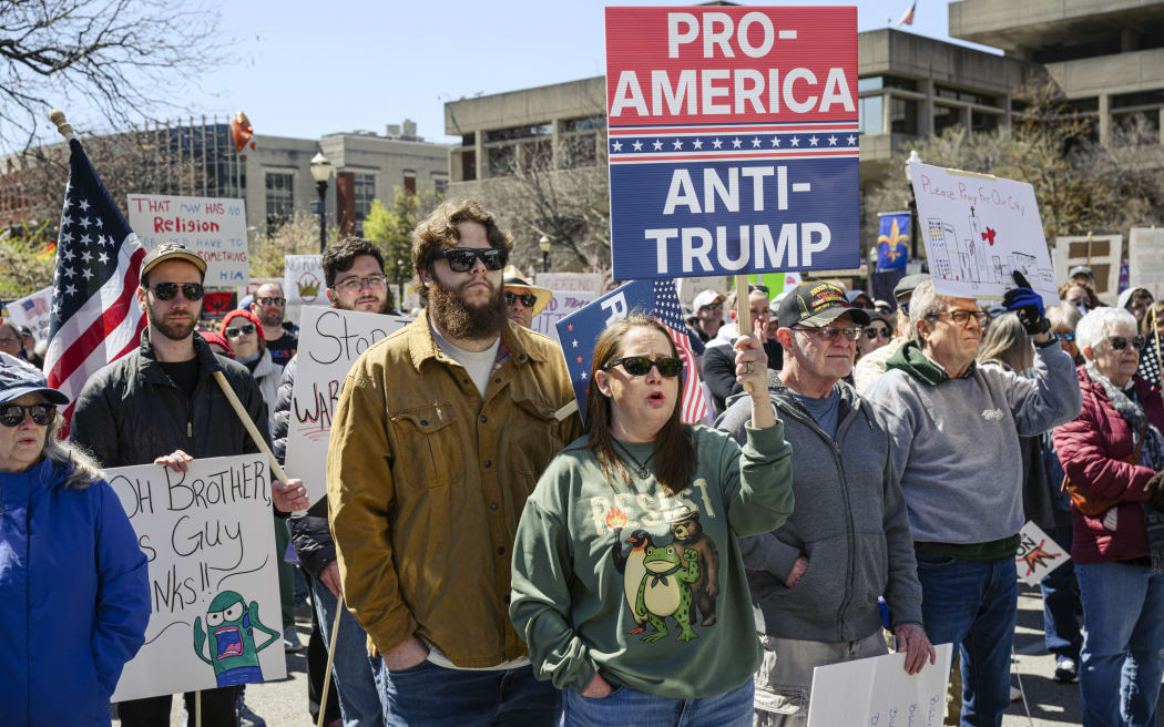LOUISVILLE, KENTUCKY - MARCH 28: Demonstrators gather at a 
