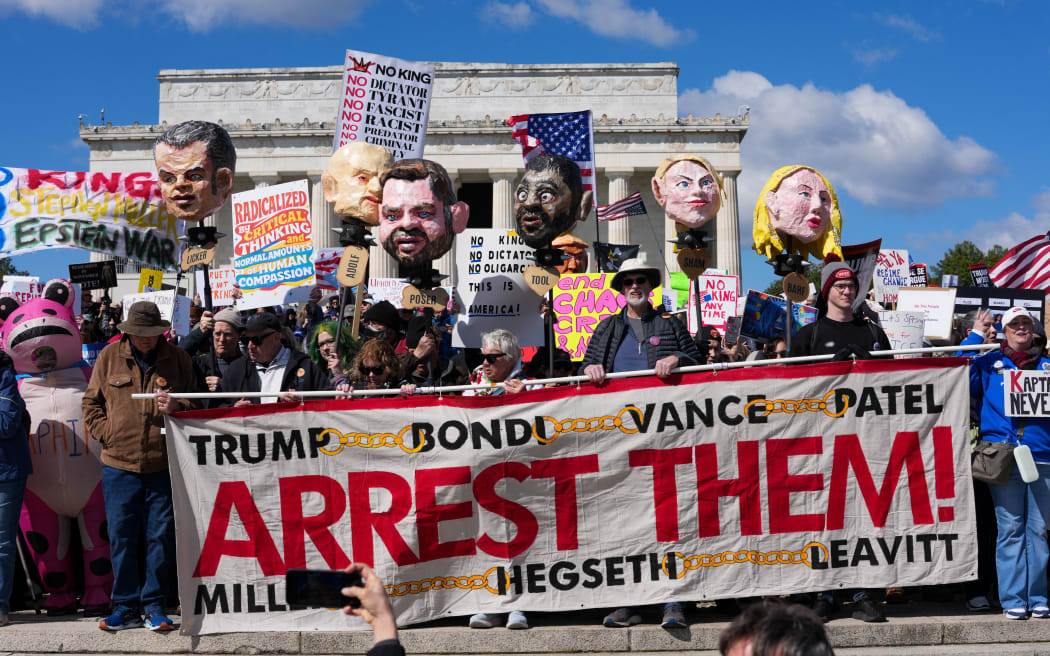 Demonstrators hold effigies of Trump administration officials as they gather at the Lincoln Memorial during the 