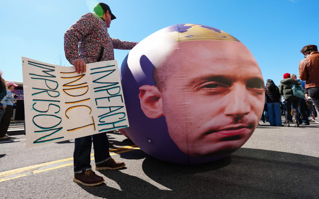Demonstrators rally against White House Deputy Chief of Staff Stephen Miller during the 