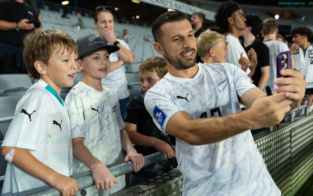 New Zealand's Kosta Barbarouses taking a photo with fans after New Zealand vs Finland, FIFA Series Tournament at Eden Park.