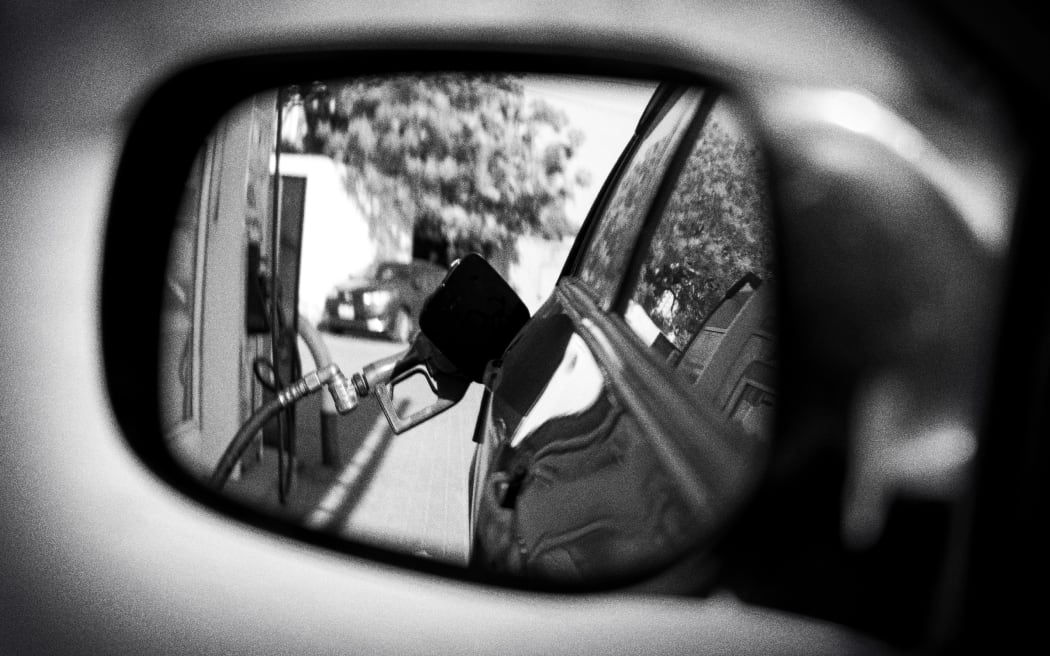 Composite of car mirror and fuel pump.