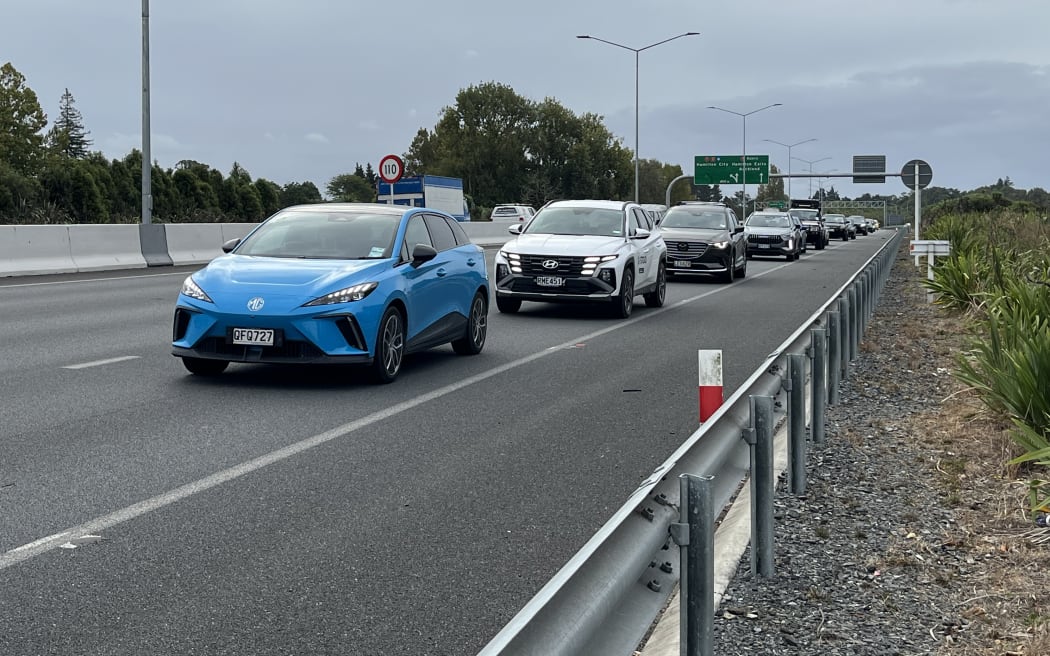 Southbound traffic on the Waikato Expressway queuing to get off at the Tamahere interchange during rush hour on a week day.