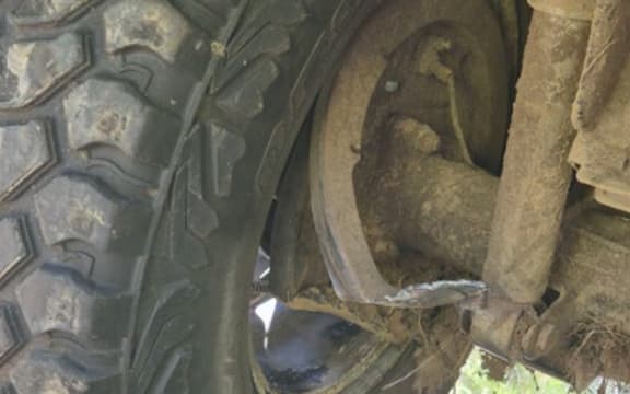 Vehicle LH rear
wheel showing
damage to under
side and evidence
of metal
components being
subjected to high
temperature