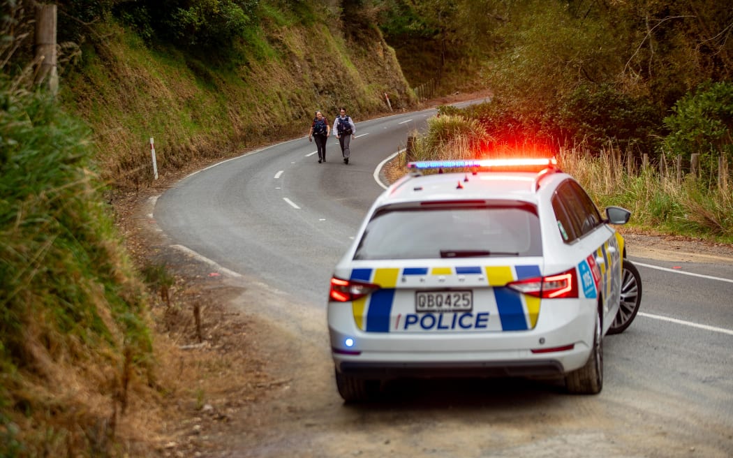 Emergency services are at the scene of a crash that's left a car upside down in a stream in rural Wellington on 25 March.