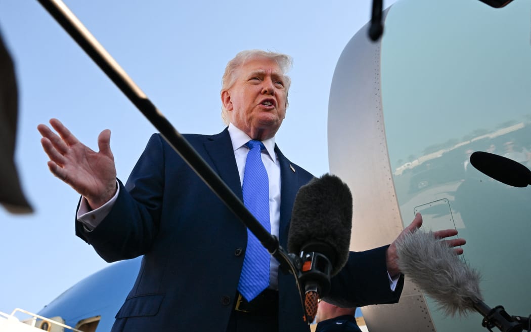 WEST PALM BEACH, FLORIDA - MARCH 23: U.S. President Donald Trump speaks to reporters before boarding Air Force One at Palm Beach International Airport on March 23, 2026 in West Palm Beach, Florida.