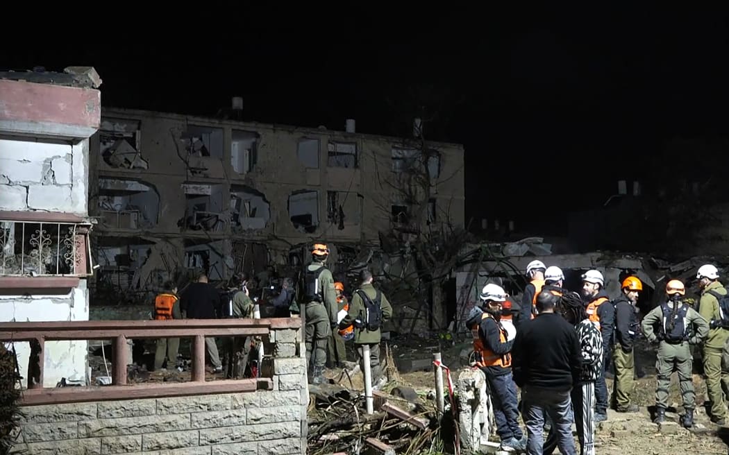 This frame grab from AFPTV footage shows damage to building in the town of Dimona on March 21, 2026. An Iranian missile on March 21, hit the Israeli town of Dimona, home to a nuclear facility, in what the Islamic republic said was retaliation for strikes on its own nuclear site at Natanz. Dimona hosts a facility just outside the main town widely believed to possess the Middle East's sole nuclear arsenal, although Israel has never admitted to possessing nuclear weapons. (Photo by Jorge NOVOMINSKY / AFPTV / AFP) /