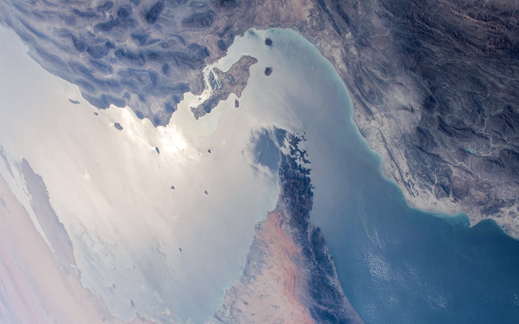 This handout photo released by NASA and taken on April 8, 2021 by the Expedition 64 crew from the International Space Station shows a view of the Strait of Hormuz in the Gulf separating Iran (top) from the United Arab Emirates and Oman (bottom). (Photo by NASA / AFP) / RESTRICTED TO EDITORIAL USE - MANDATORY CREDIT 