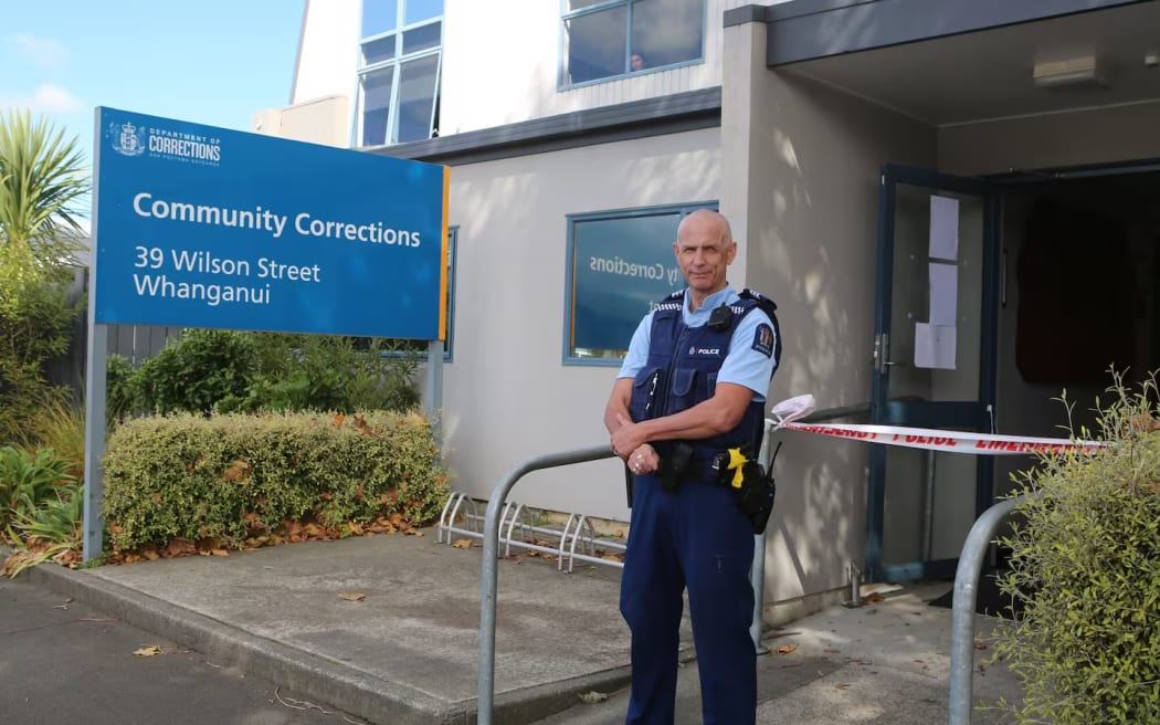 Police guarded the Community Corrections office in Whanganui after the probation officer was attacked.