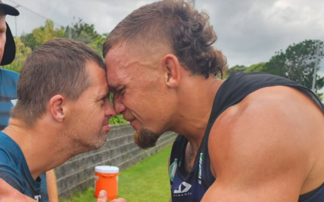 Mark 'the mahi man' pictured here with Warriors skipper James Fisher-Harris, will lead the Warriors onto the field this weekend to celebrate World Down Syndrome Day.