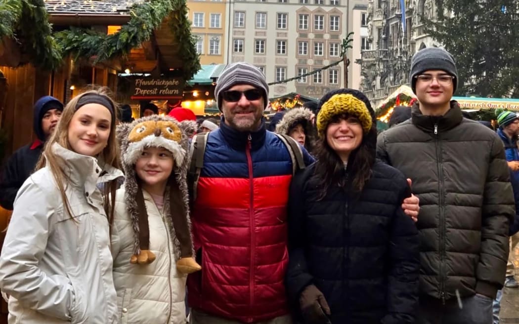 Racanelli in Tuscany with his wife Lynn and their children.