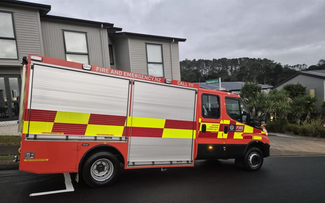 Firefighters at the scene of a fire in a townhouse in the Auckland suburb of Albany Heights on 16 March 2026.