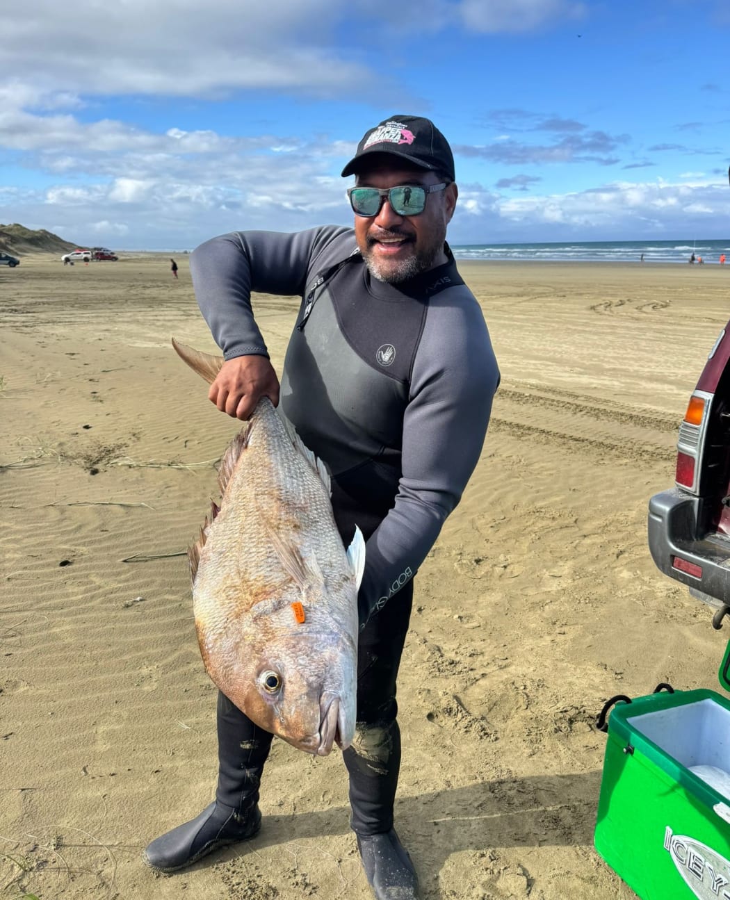 Kaitāia man Harley Ra with the snapper than earned him more than $30,000.