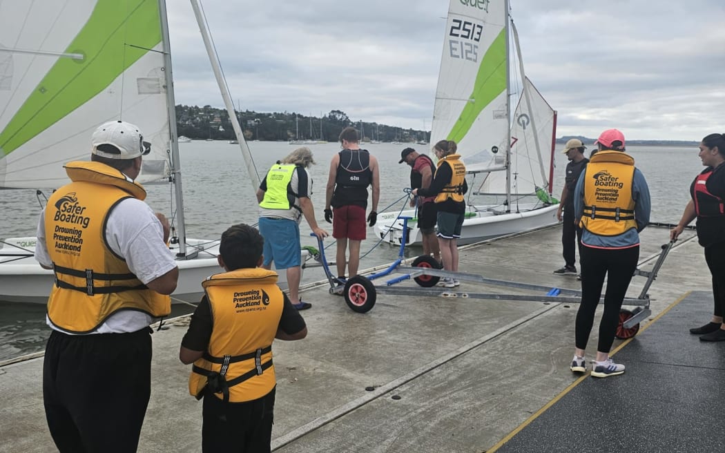 Participants prepare training yachts during a Tagaloa Sailing Project session in Auckland.