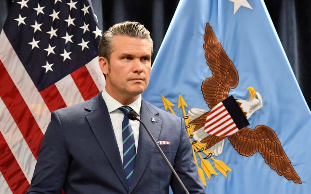 US Secretary of Defense Pete Hegseth looks on during a joint press conference with Admiral Charles Bradford 