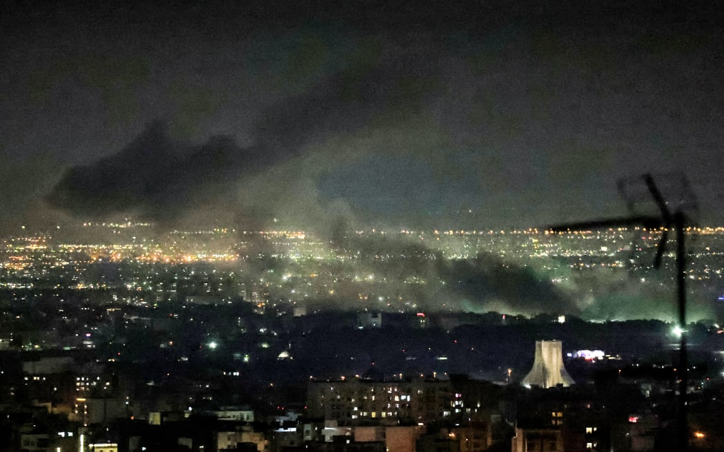 Smoke plumes billow from the site of airstrikes near Azadi Tower in western Tehran on March 10, 2026. The United States and Israel launched strikes against Iran on February 28, sparking swift retaliation by the Islamic republic which responded with missile attacks across the region. The war has dragged in global powers, upended the world's energy and transport sectors, and brought chaos to even usually peaceful areas of the volatile region.