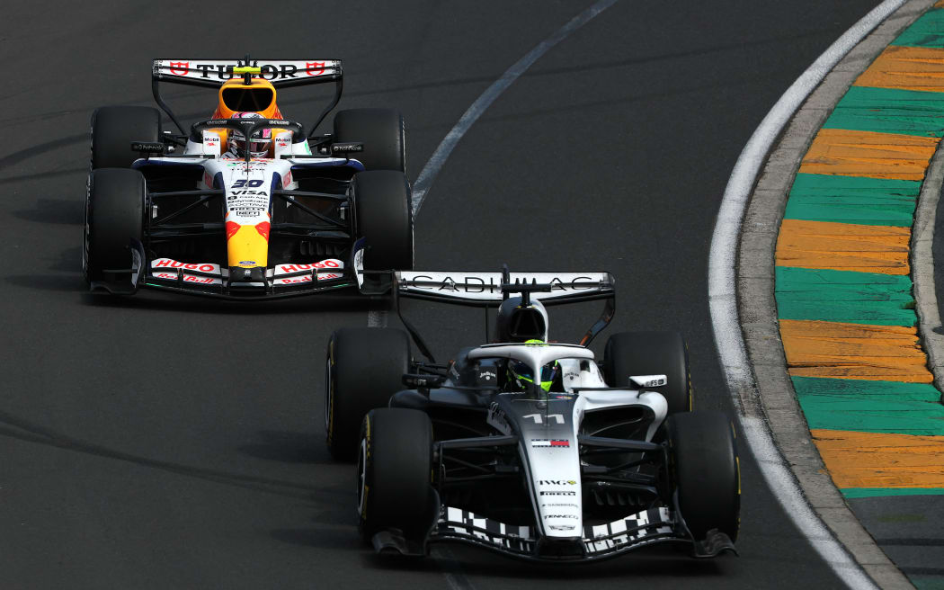 Cadillac's Mexican driver Sergio Perez (R) and Racing Bulls's New Zealand driver Liam Lawson compete during the Formula One Australian Grand Prix in Melbourne, 8 March, 2026.  (Photo by Martin KEEP / AFP) / -- IMAGE RESTRICTED TO EDITORIAL USE - STRICTLY NO COMMERCIAL USE --