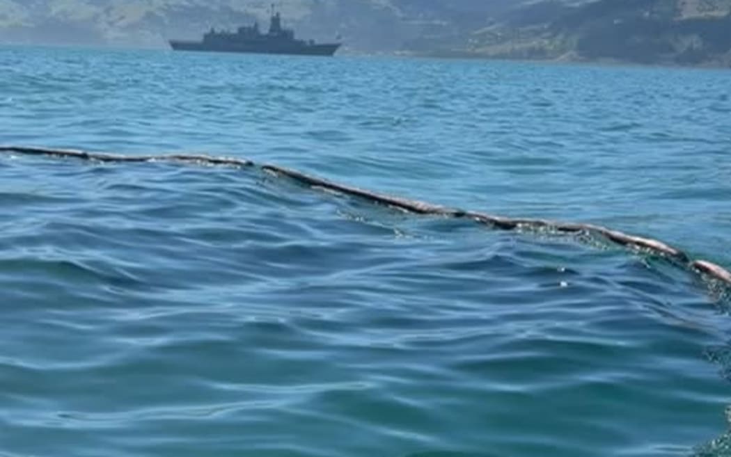 Oil spill from HMNZS Te Kaha is contained on Akaroa Harbour.