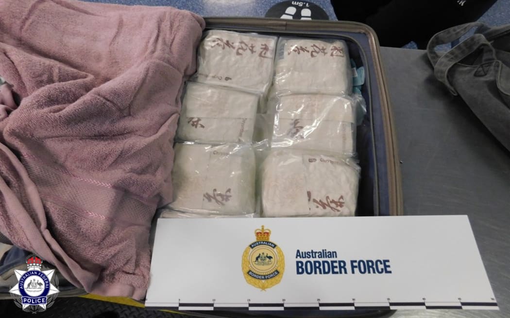 A New Zealander is accused of trying to import 38 kilograms of methamphetamine into Australia by hiding it under some towels in suitcases.