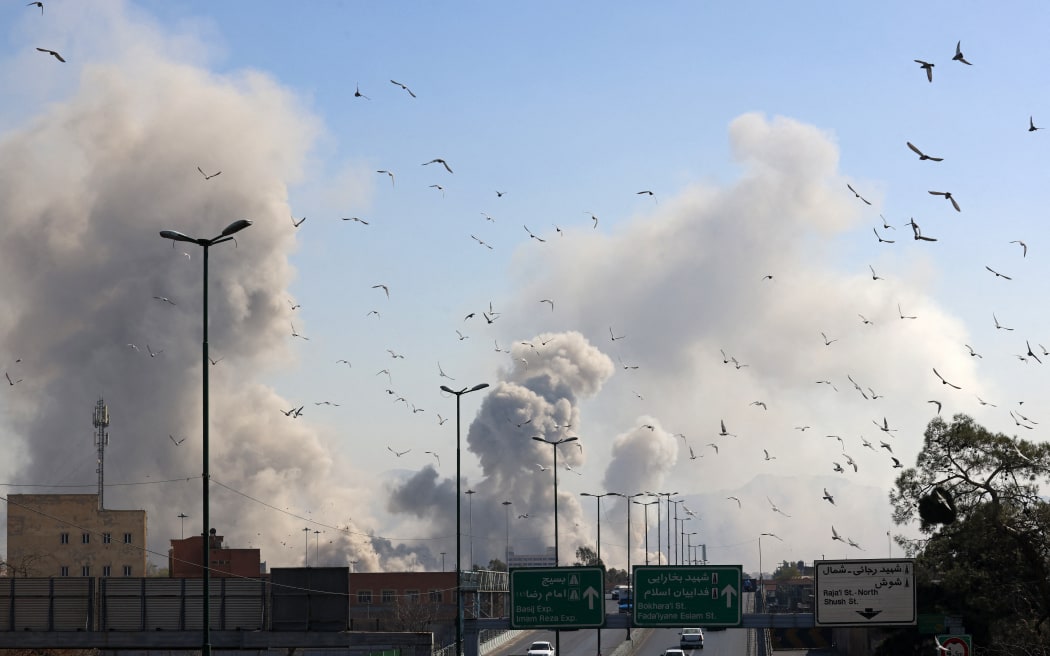 A plume of smoke rises after a strike on the Iranian capital of Tehran on March 5, 2026. Israel pounded Tehran with fresh strikes and Iran targeted Kurdish guerilla groups in Iraq on March 5 as a spiralling war in the Middle East engulfed the entire region. (Photo by ATTA KENARE / AFP)