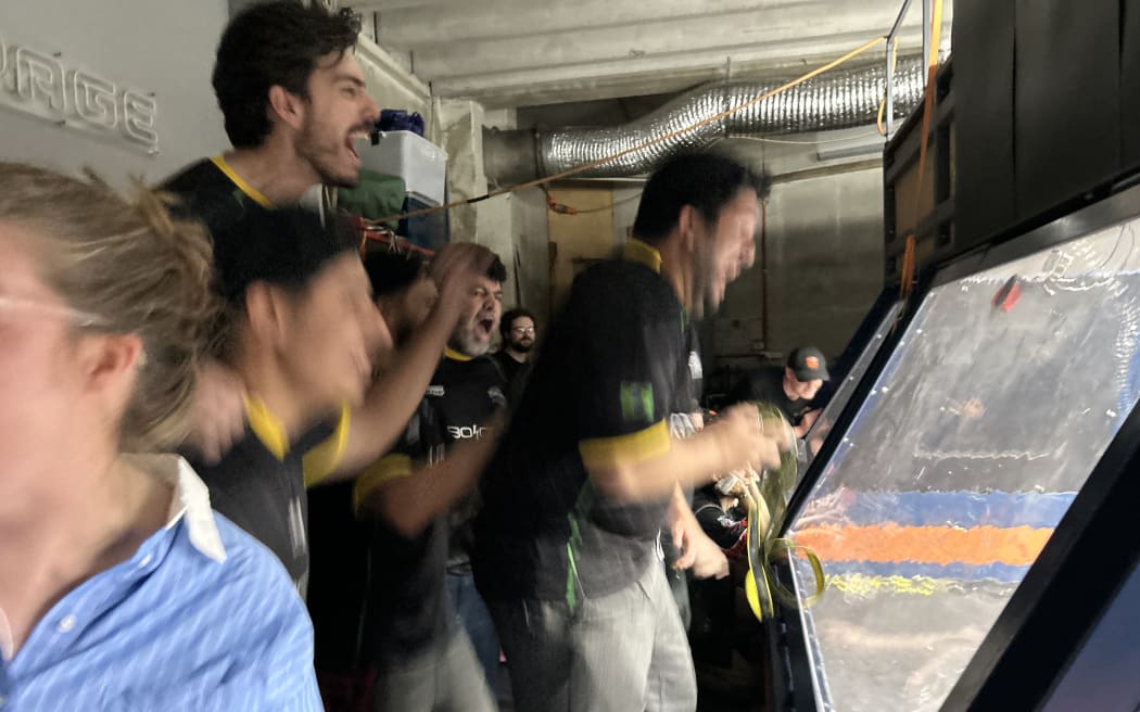 Photo of a group of people jumping in joy.