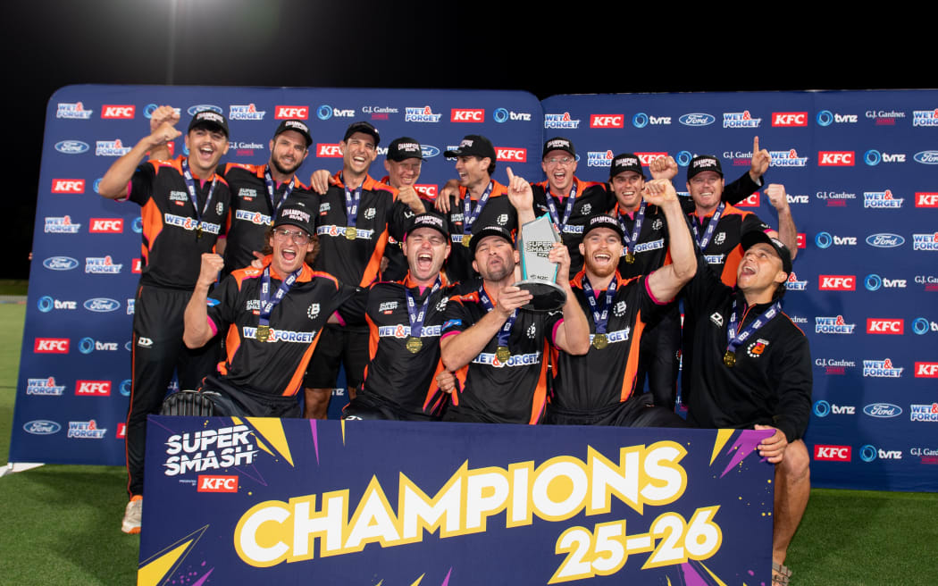 Northern Districts celebrate winning the men's Super Smash grand final.